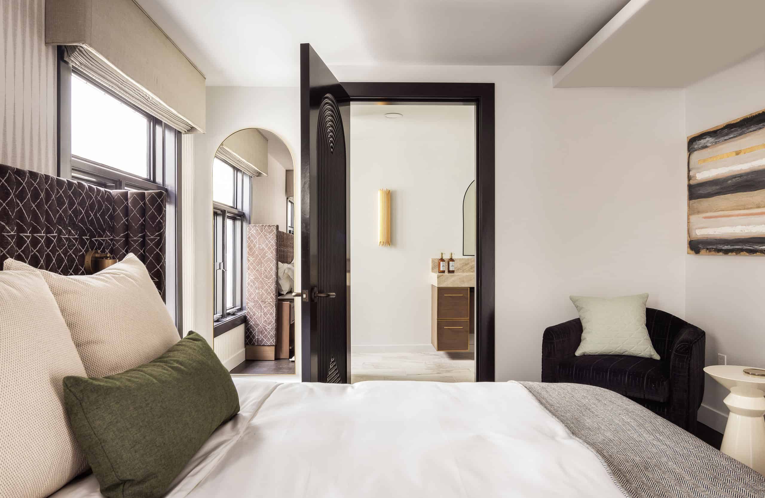 Bed inside of The Nook hotel room at Orli La Jolla boutique hotel
