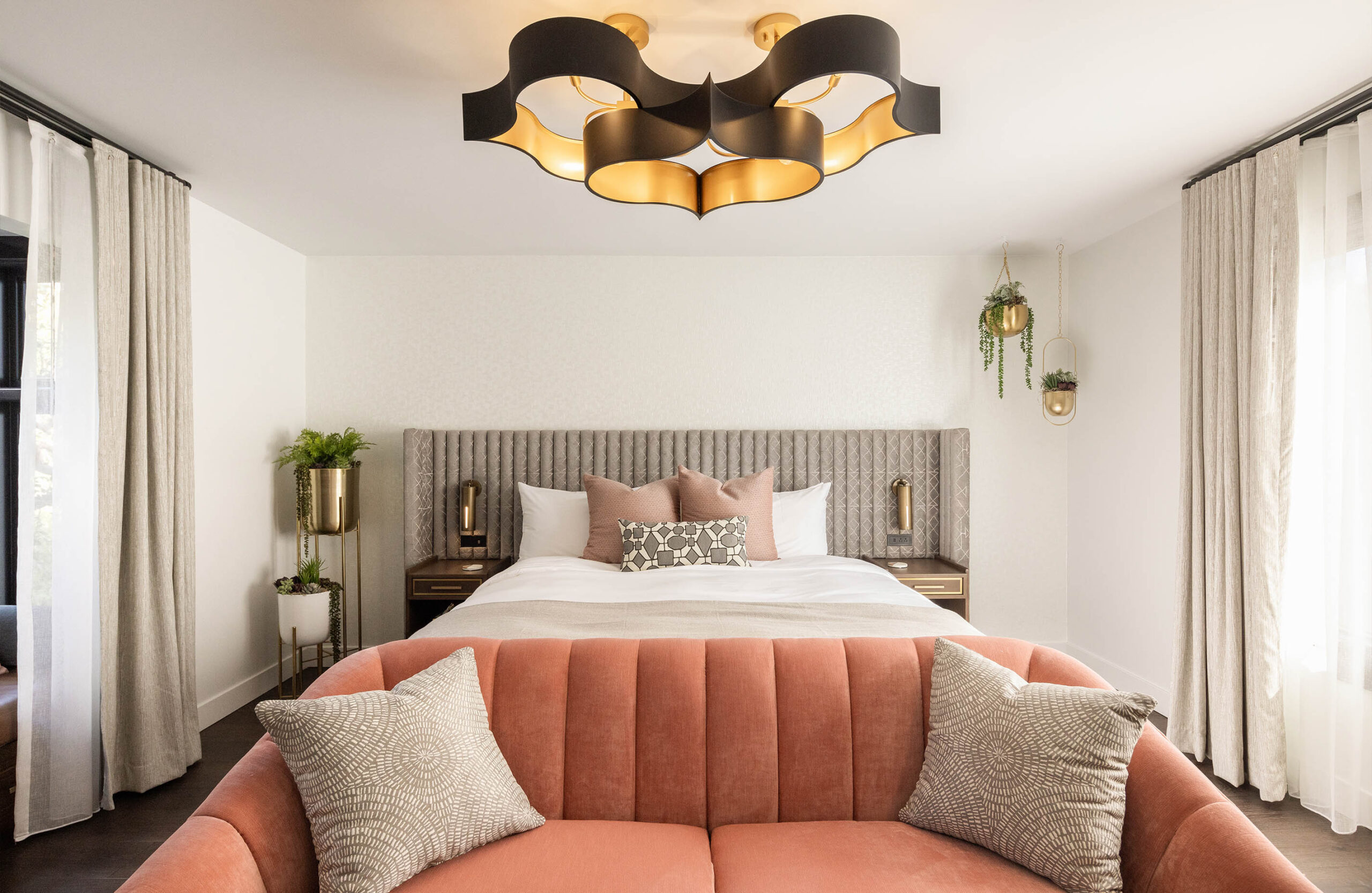 Bed inside of The Conservatory hotel room at Orli La Jolla boutique hotel