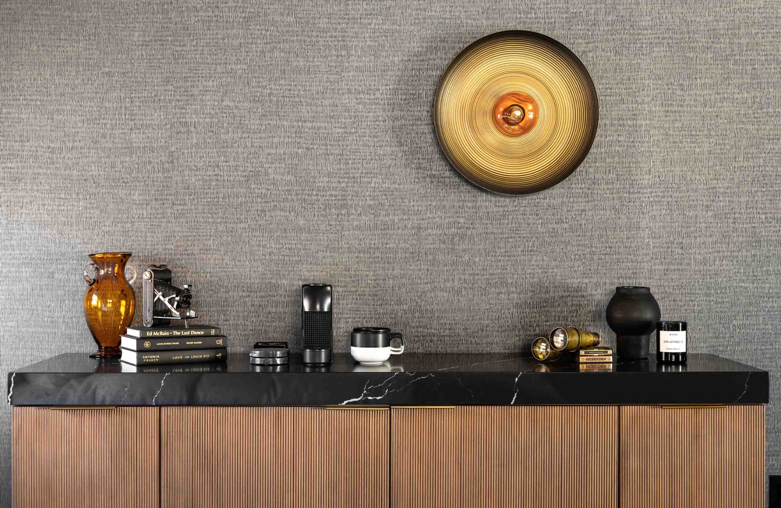 Decorations on top of a shelf in The Irving Gill Penthouse at Orli La Jolla boutique hotel