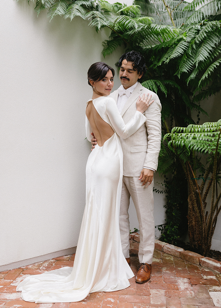 bride and groom posing for a photo