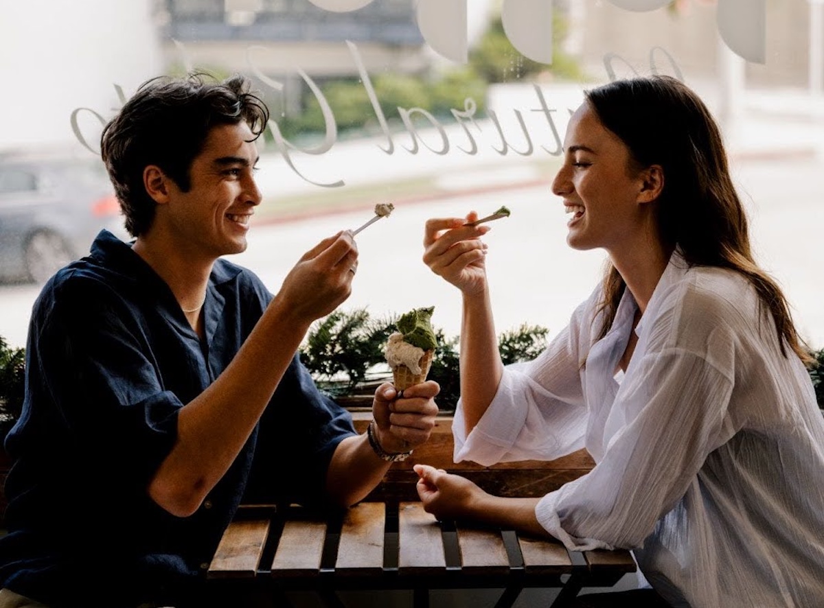 Two people sharing ice cream